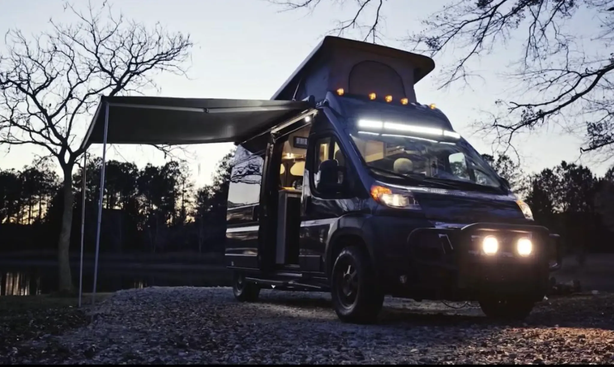 Cozy van camping at night with lights